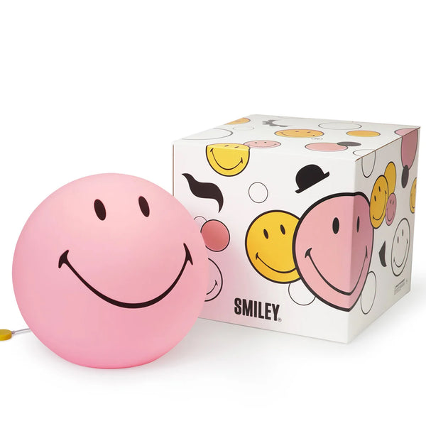Pink smiley face ball with a box featuring smiley face designs on a white background